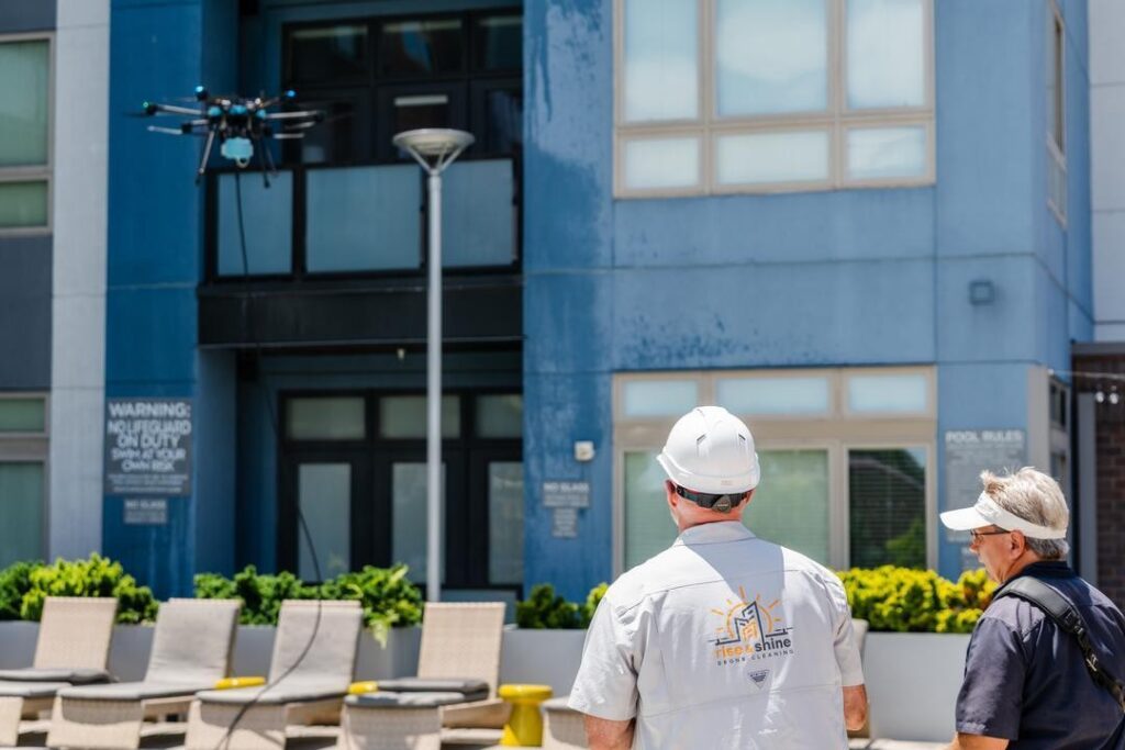 Lucid Bots Sherpa drone cleaning the exterior windows of Savoy Apartments in Uptown Charlotte, NC.