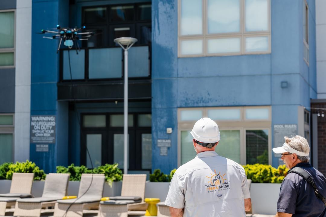 Lucid Bots Sherpa drone cleaning the exterior windows of Savoy Apartments in Uptown Charlotte, NC.